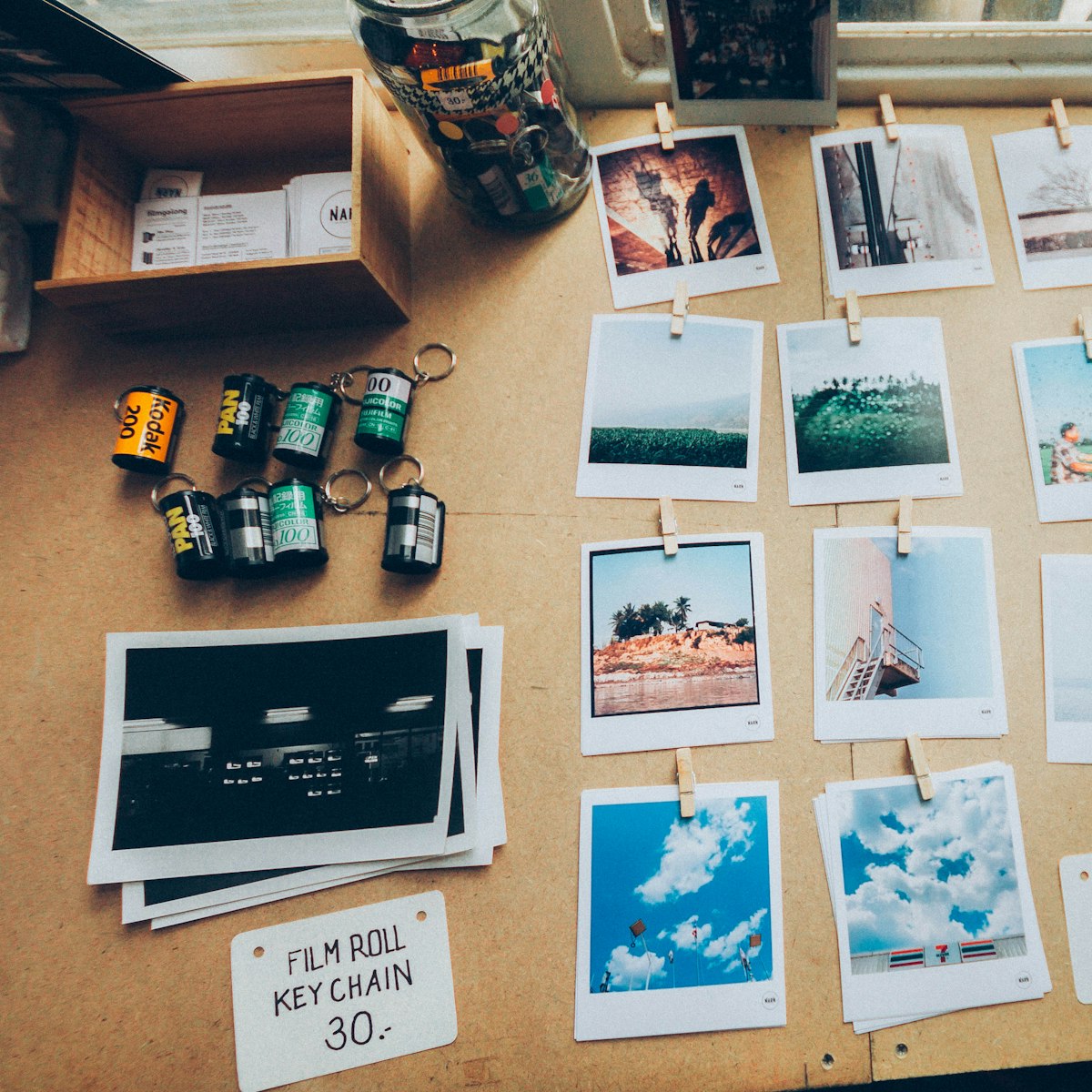 Printed photos spread on a wooden table