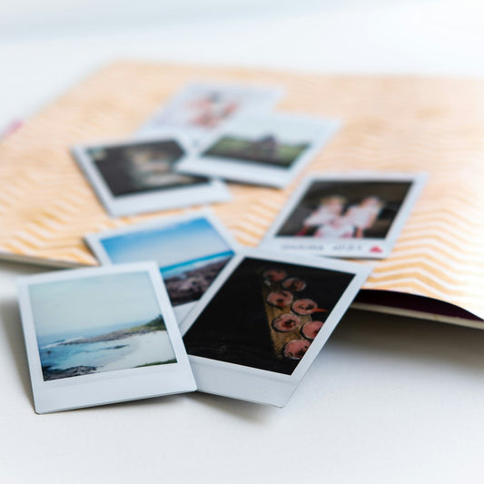 Printed photos on a white table