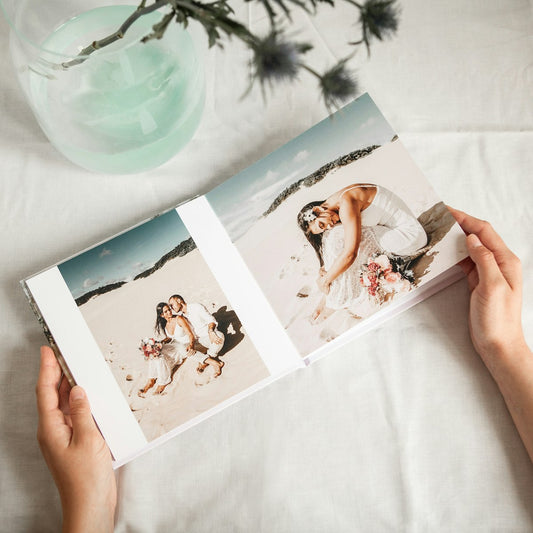 Photo book open to a wedding photo
