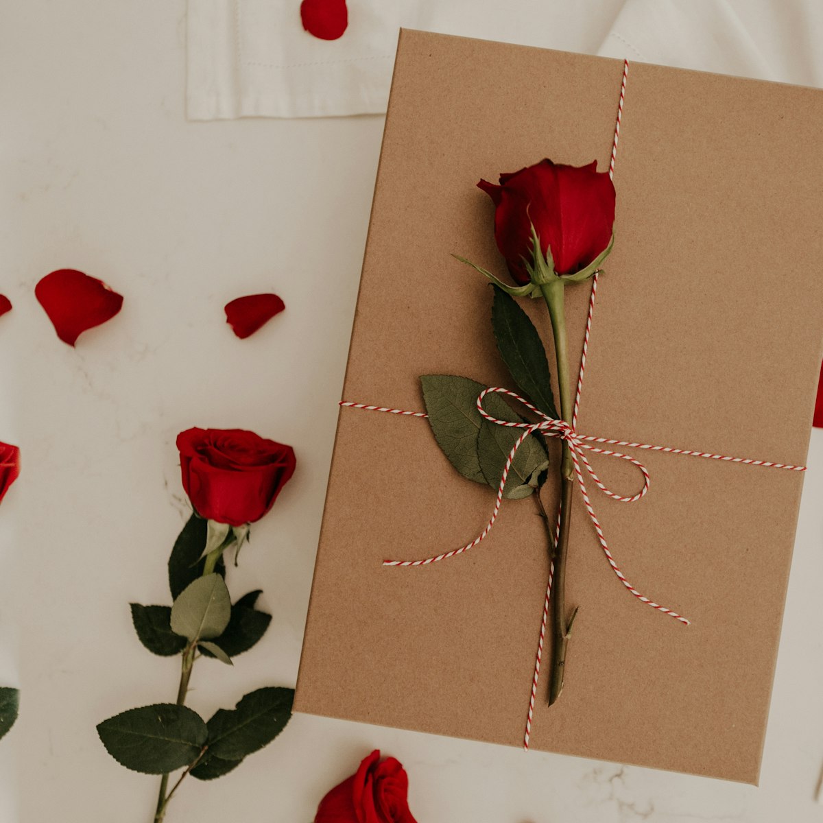 Red rose on a brown envelope