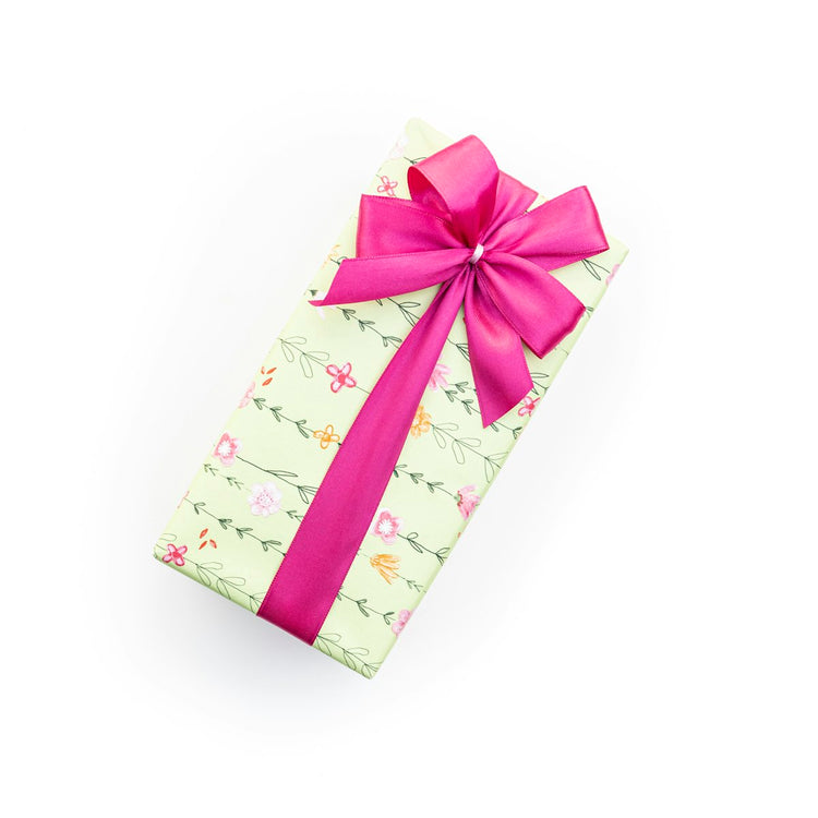Pink polka dot gift box with a pink ribbon