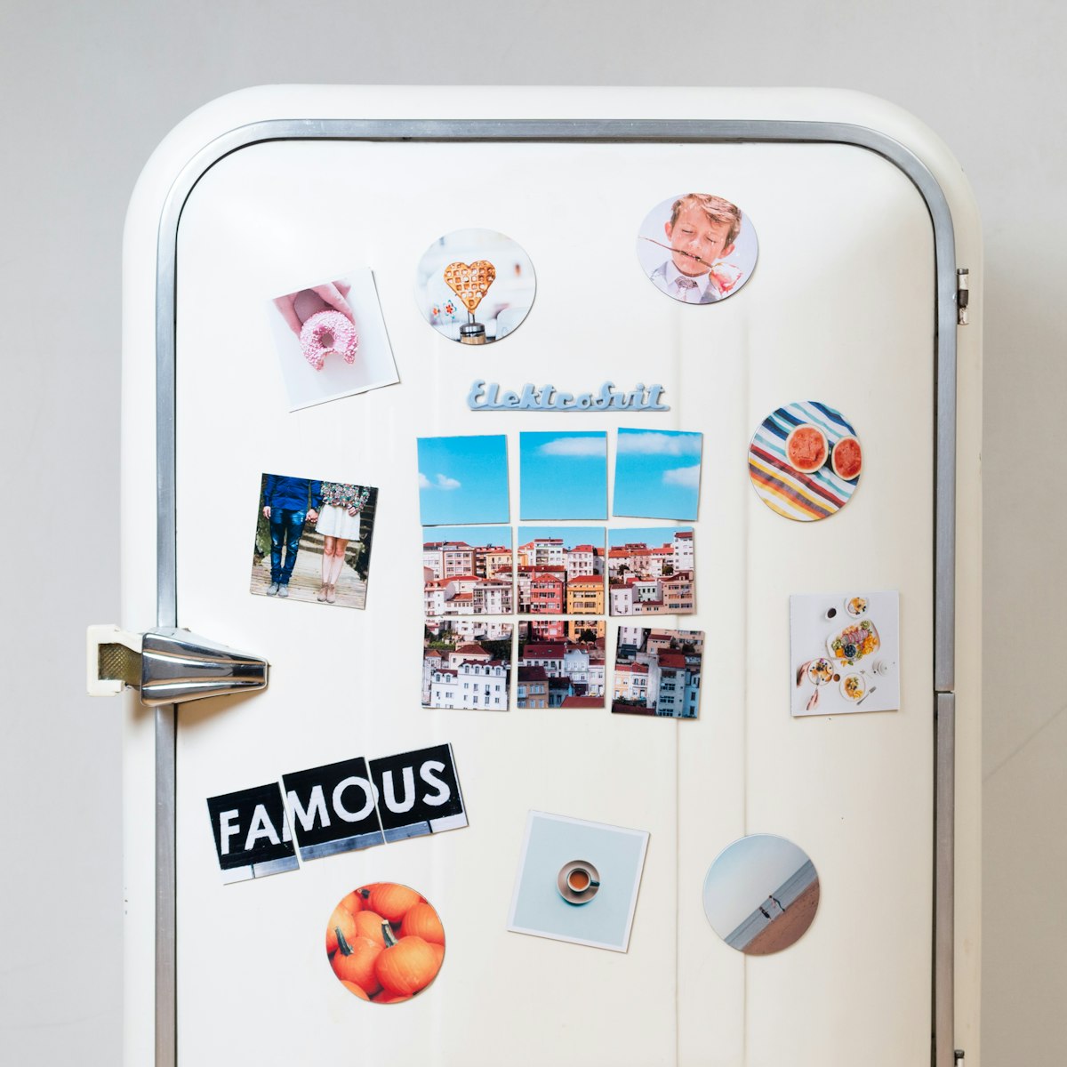 Printed photos stuck on a white fridge
