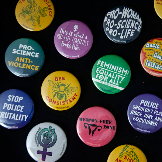 Assorted round pin-back badges